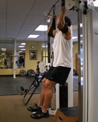18 Hanging Side Crunches - Hang from a pull-up bar (or with arms inside straps) with