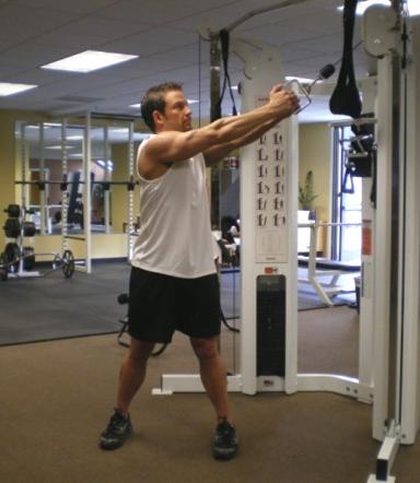 20 Standing Cable Crunch - Place your feet shoulder width apart with your arms around a cable pulley handle.