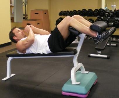 22 Incline Ab Crunches - Sit on a 45 degree incline bench. Make sure you lower back is flat and abs are contracted.