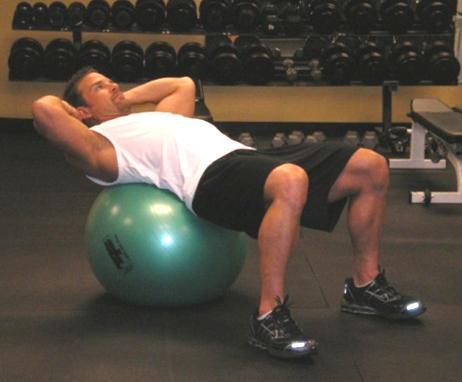 31 Ball Oblique Crunch - Lie across the top of a stability ball with your feet placed firmly on the