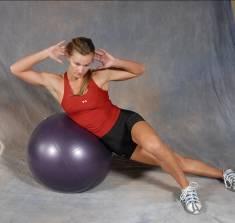 34 Side Lying Ball Crunch - Lie across a fitness ball making contact with the top of your hips and oblique muscles (side ab muscles).