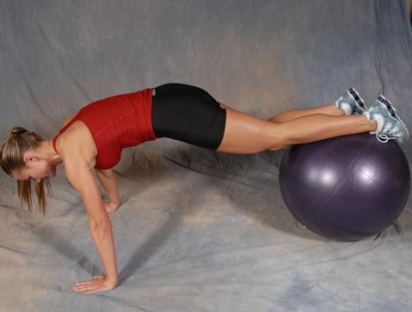 36 One Leg Tuck In -In push up position, place your feet on the ball.