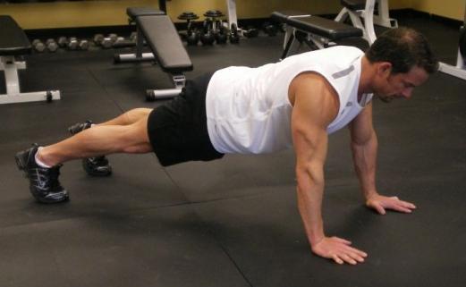 3 One Arm Plank - Starting with your hands shoulder width apart on the ground and your upper body elevated.