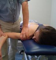 Glenohumeral Anterior Arthrokinematic Assessment - Patient Positioning: Prone, arm off the edge of the bed, humeral head off the edge as well (or wedge under coracoid) appropriately undressed -
