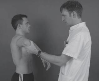 Therapist places the shoulder in 90 deg of elevation in scapular plane.