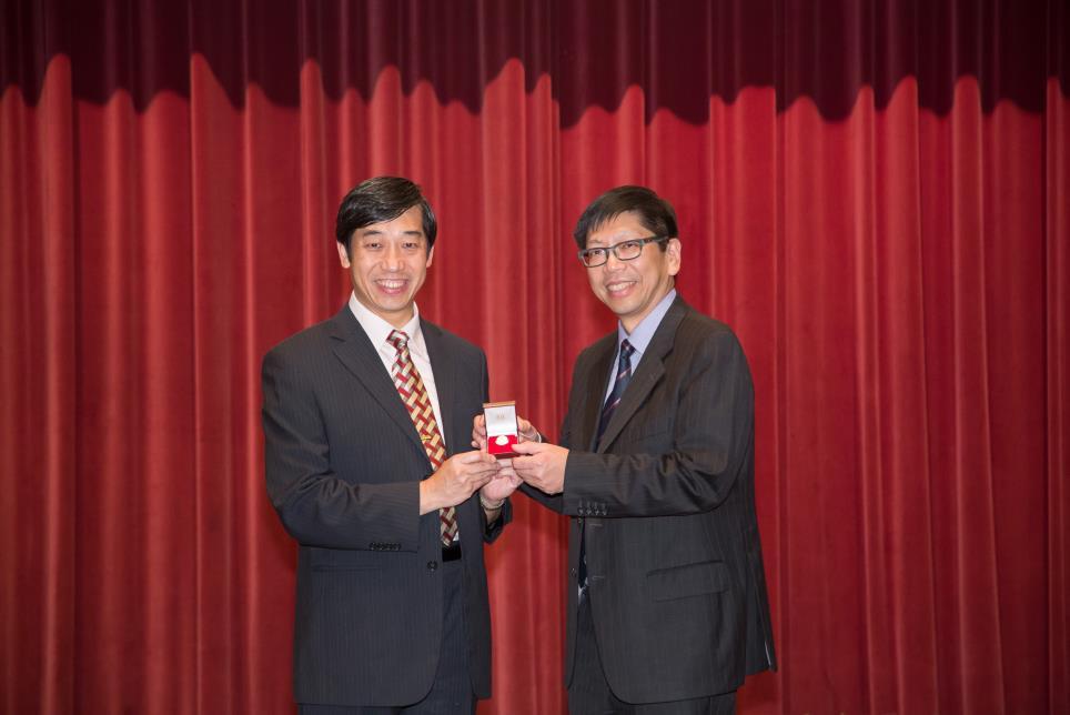 Council News Professor Edward C M LO received the Meritorious Service pin for completion of term of office for