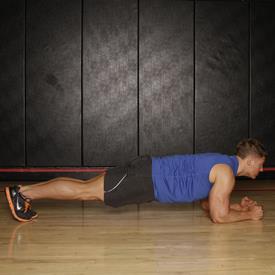 PRONE PLANK 1. Get into a prone position on the floor, supporting your weight on your toes and your forearms.
