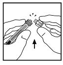 While holding the adapter in the package, place the vial adapter over the vial.