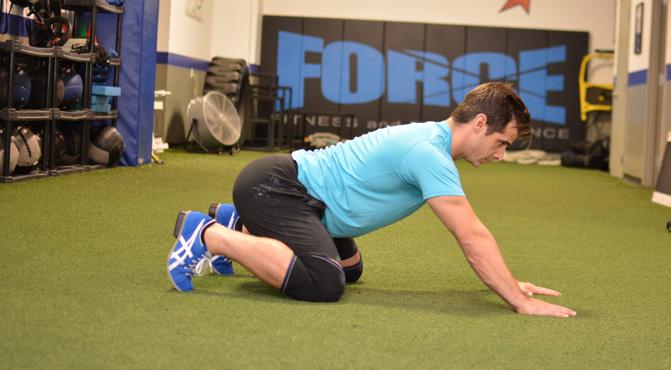 Figure 2 Four-point squat/rock back horizontal) torso with the hips near the ankles and the eyes focused directly ahead.