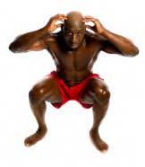 Carefully lower yourself to a full deep squat so your thighs are parallel to the floor.