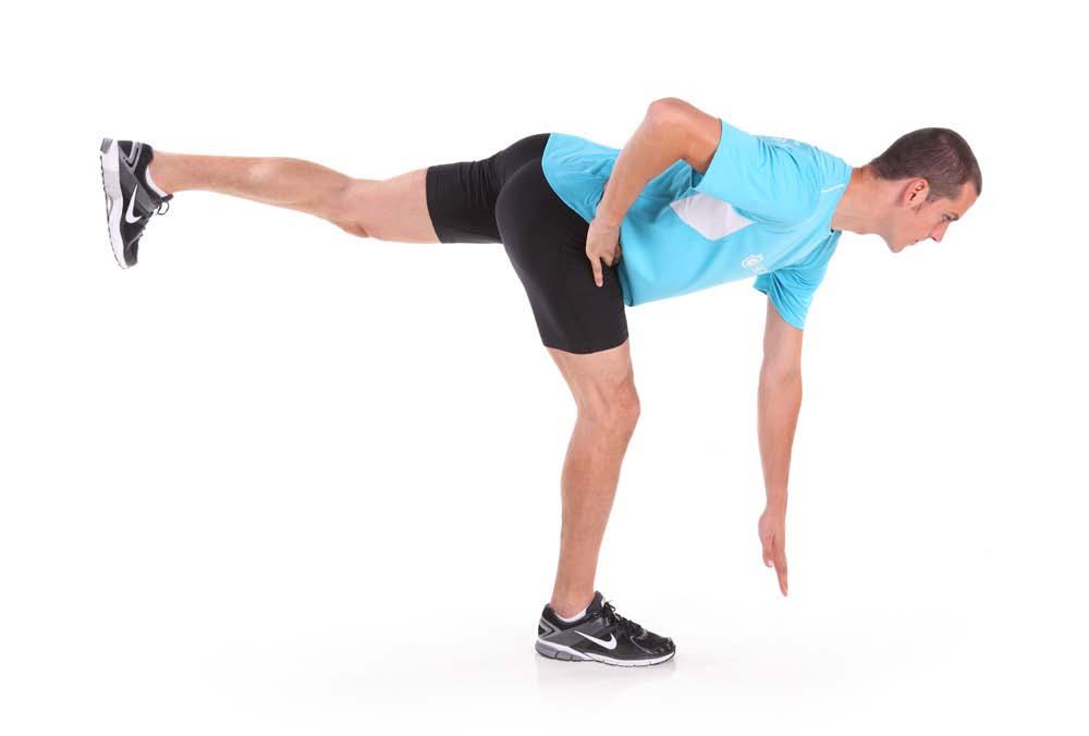 Simultaneously raise the leg of the same side off the ground. Lower your torso and raise your leg until they are parallel to the ground. Pause and return to the starting position.