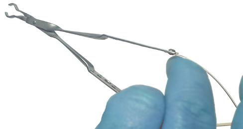 forceps apart, place the implant