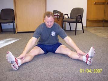 Straddle Stretch Groin, Hamstrings, Low Back Sit upright with legs straight.