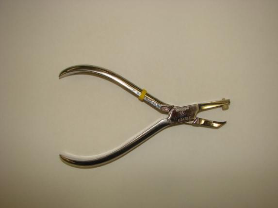 Figure 1 Figure 2 One side of the pliers has a soft, padded portion that is designed to go on the occlusal aspect of the tooth.
