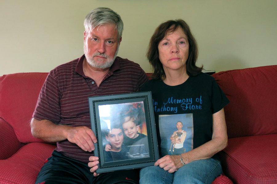 Cris and Valerie Fiore hold one of their favorite pictures of their sons Anthony (with the dark hair) and Nick. Anthony died from a heroin overdose in May 2014 at the age of 24.