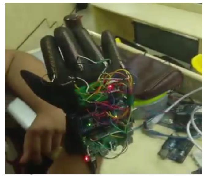 Figure 6: The data / gesture from the glove are sent as a JSON which the app displays in a readable format and reads out loud. Figure 7: Meri Awaaz - Smart Glove. VI.