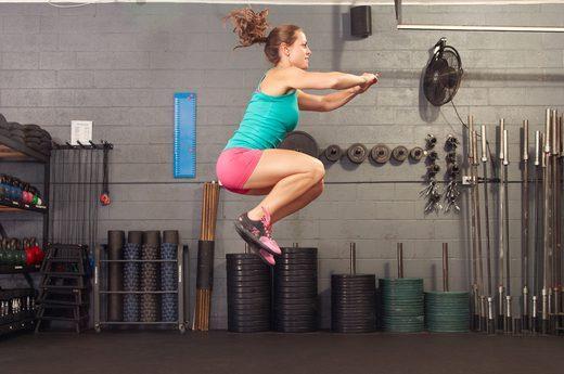 At the top of your jump, spread out your arms and legs so that you re making an X with your body. Return to the squatting position and repeat.