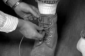 Make a simple knot at one end and place it through the hole on the outside of the shoe (on the patient s strong side). 3. Bring the lace across the shoe down through the first hole. 4.
