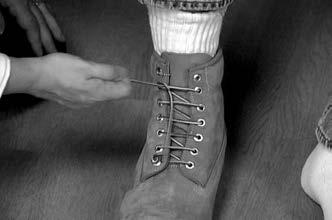 Tuck the shoe lace (toward the toe) under laces which span the last two holes at the top of the shoe. 3. Pull and cinch toward the strong side. 4. If the laces are too long, you can cut the laces.