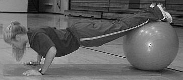 Push-Up (Hands on Floor) In a prone position, with ball under legs, place