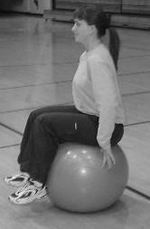 Sit on ball, lift feet off floor and press heels into ball. Extend one leg.