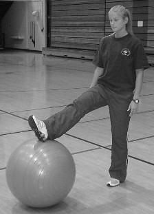 4-Point Balance Balance on top of ball.