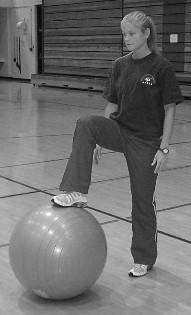 Hip Lift Place feet on ball stacked on top of each other, hands on