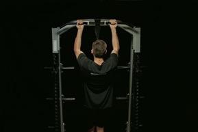 Hold onto the bar, hands shoulder-width apart with a supine grip - palms up.