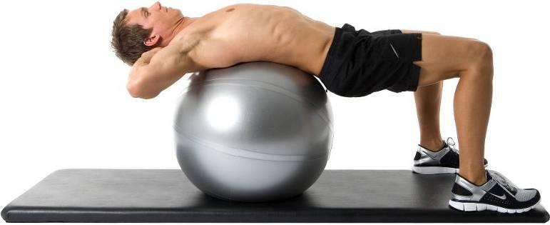 Exhale as you slowly curl your ribs to your hips and lifting your head and shoulders curling your upper body up slightly off the ball.
