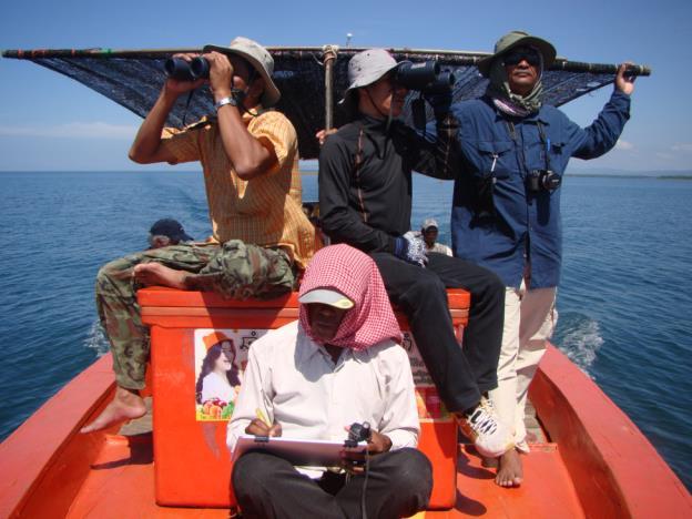 Figure 2. Survey team searching for dolphins and porpoises in the coastal waters offshore the Peam Krasop Wildlife Sanctuary.