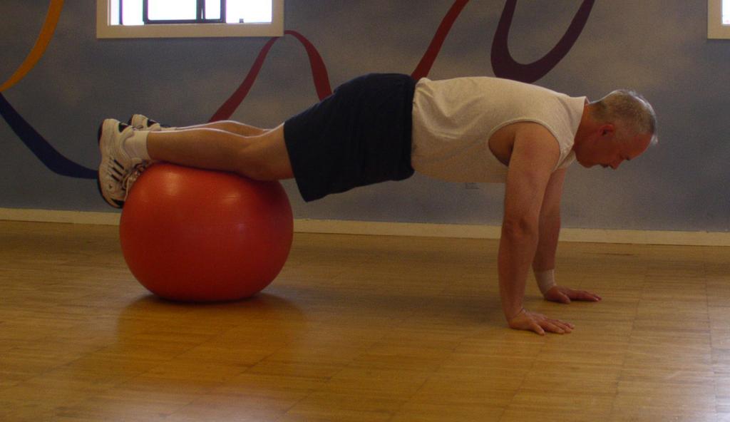 Stability Ball Prone Roll-Ins To start kneel on all fours with the Stability ball in front of you. Place your upper body on the ball with your hands out in front in a push-up position.