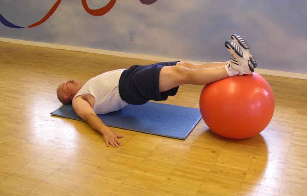 Stability Ball Supine Roll-Ins To begin place a mat on the floor with a stability ball on one end.