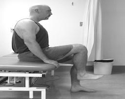 Hip Flexion Quadriceps - Stretching Sitting, lift knee to chest.