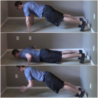 Dive Bomber Pushup 1. Start with your feet outside shoulder width apart and in the pike pushup position with your glutes in the air. 2.