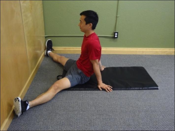 Hip Conditioning Program Seated Hip Adductor Stretch Instructions: Sit on the floor facing a wall.