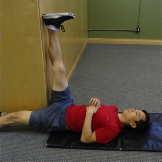 Cross one leg over the other and pull the bottom thigh towards your chest until a stretch is felt in side of the hip.