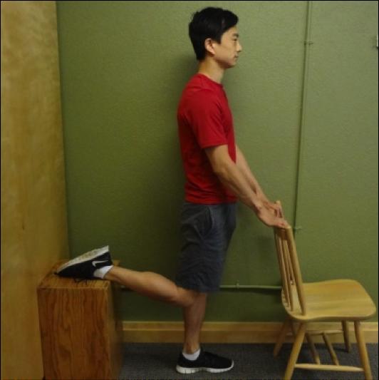 Doorway Hamstring Stretch Instructions: Lay on your back close to a door frame or wall.