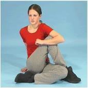 Gluts and ITB Sit on the floor with your legs bent. Cross one leg over the other. Put your arm around the leg to be stretched.