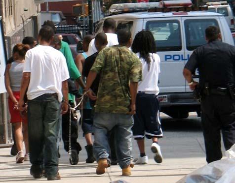 Young arrestees being led into the Brooklyn Court