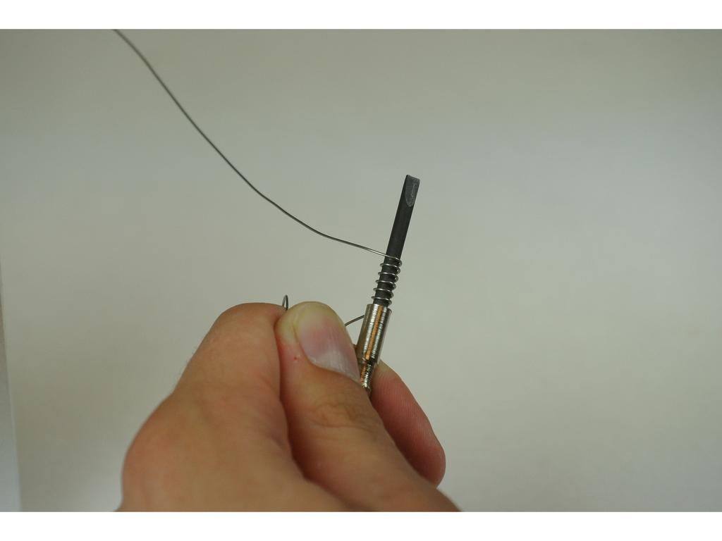 Step 4 Using the loose end of the wire, wrap 4-8 times (depending on desired ohms) around the