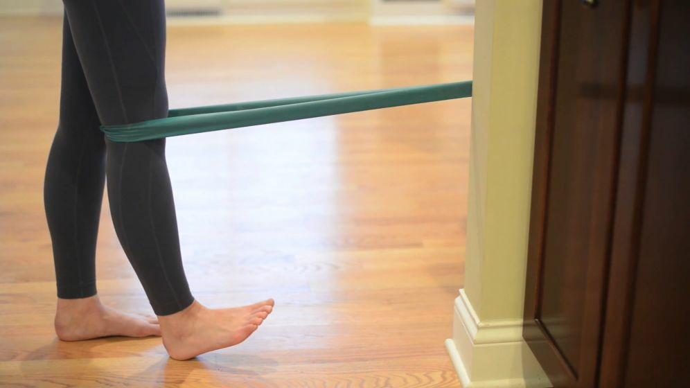 Page 7 of 8 Functional Knee Extension with Tubing Sets 1 Reps 20-30 Sessions per day 1 Anchor tubing in a door or to a sturdy object and position it behind your involved knee.