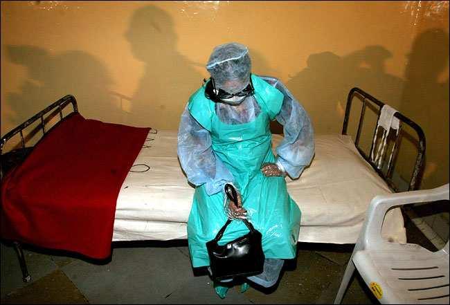 Transmission mechanisms Infection control practices, SARS outbreak, 2003 Reuters: An Indian woman diagnosed with SARS sits on her bed at the Doctor Naidu Infectious Diseases Hospital in the western