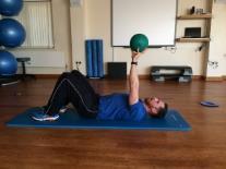 Serratus Anterior Press Lying on your back holding a ball/medicine ball in the hand