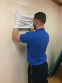 Wall Slides With your hands inside a pillow case (a theraband works well too), push your forearms out to create
