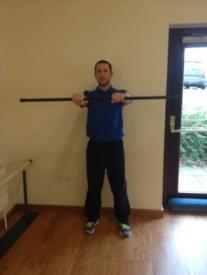 Forward Raise Grab a pair of dumbbells and let them hang at arm s length next to your body.