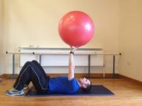 Single Arm Gym Ball Raise Lying on your back with your knees bent up, gym