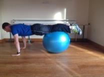 Over the Top Roll over a gym ball so that quadriceps muscles (thighs) are resting on