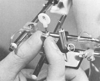46 Loosen the centric pin lockscrews and with a slight twisting motion, remove centric pin records (Fig. 47). Fig.