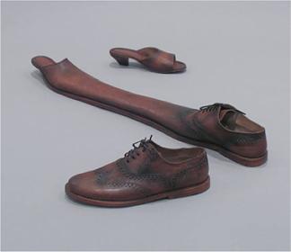 A Cuban sculptor, Juan Capote, designed a shoe for two people. You can see how awkward it would be to wear such a shoe.
