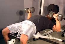 Exercise #1 Description (Describe how this exercise should be performed) Sit on the edge of a flat bench with dumbbells on your knees.